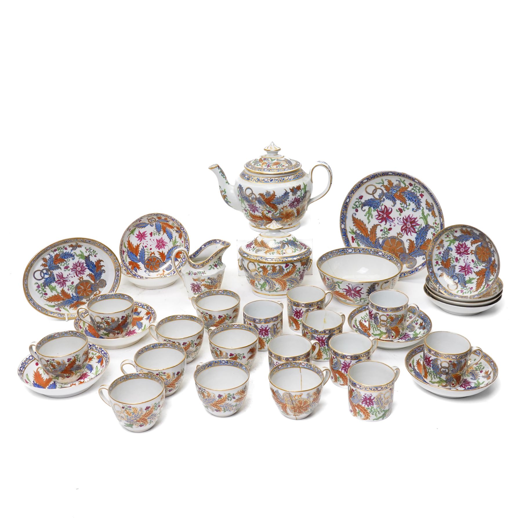 New Hall part tea and coffee service richly decorated  with a Tobacco Leaf design in pattern 274 comprising nine tea cups, eight coffee cans, ten saucers, tea pot and stand, sucrier and cover, slop bowl, milk jug and plate, circa 1800