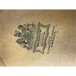 Early 20th century black silk top hat by Woodrow of Manchester and London, with manufacturer's stamp to the silk lined interior, housed in fitted tan leather hat box with removable internal compartments with straps, brass escutcheon and engraved plaque, hat internal measurements approx 20cm x 15cm