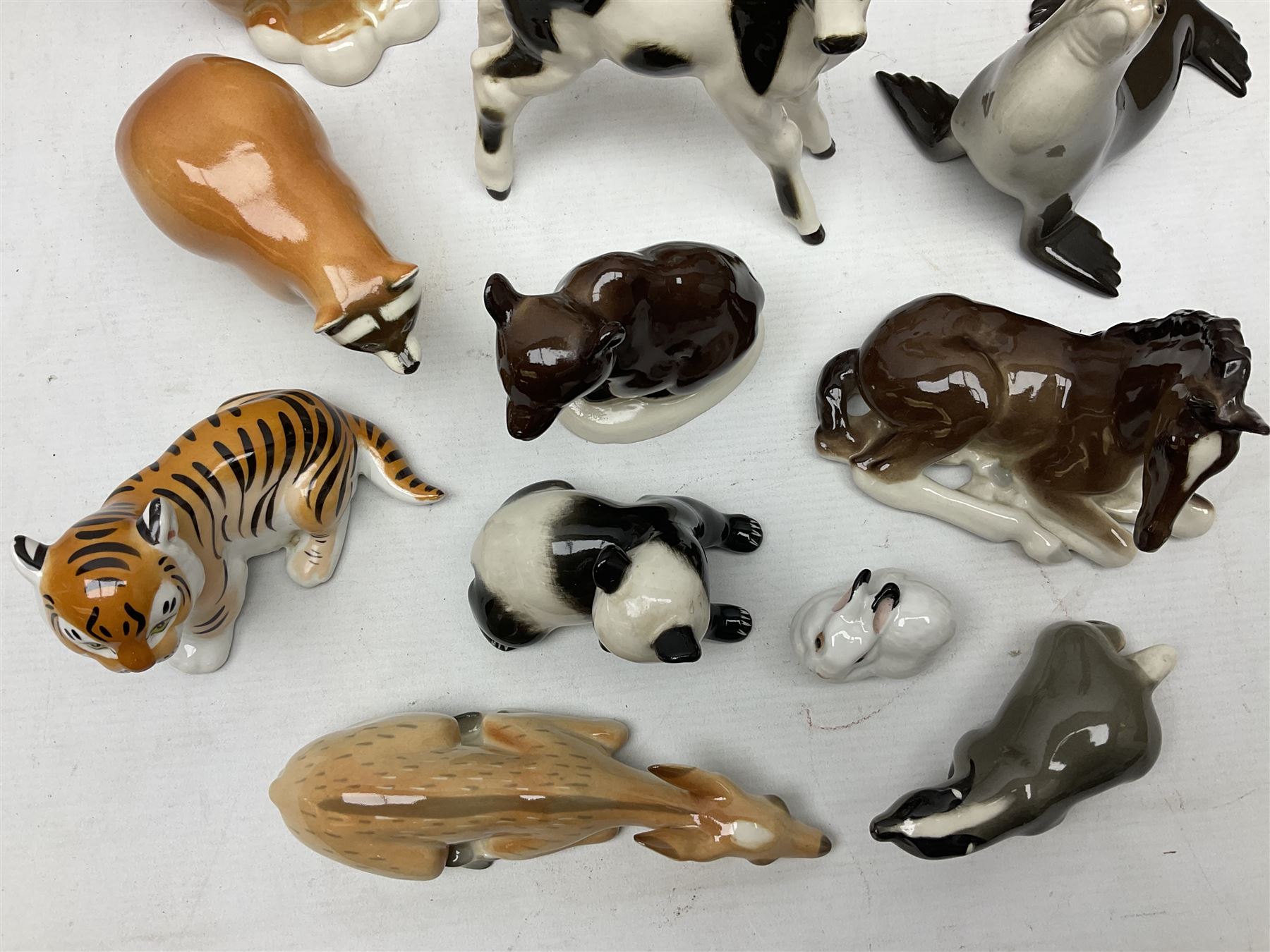 Collection of Russian Lomonosov USSR animal figures, to include  lynx, tiger, red panda, sealion, panada, etc 