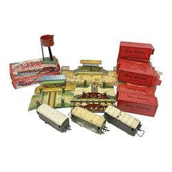‘0’ gauge - six boxed Hornby Hachette coaches comprising three Saloon Cars and three Dining Cars in original boxes; three loose ‘SNCF’ cars; three crossings, two Hornby/Meccano railway stations, one bridge and a water tank; two further Mettoy Railways ‘Railway Bridge’ in original boxes (17)