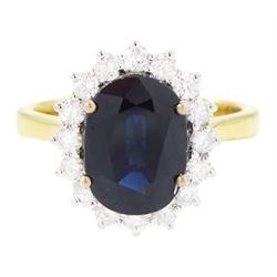 18ct gold sapphire and diamond cluster ring, single oval cut sapphire of approx 2.60 carat...