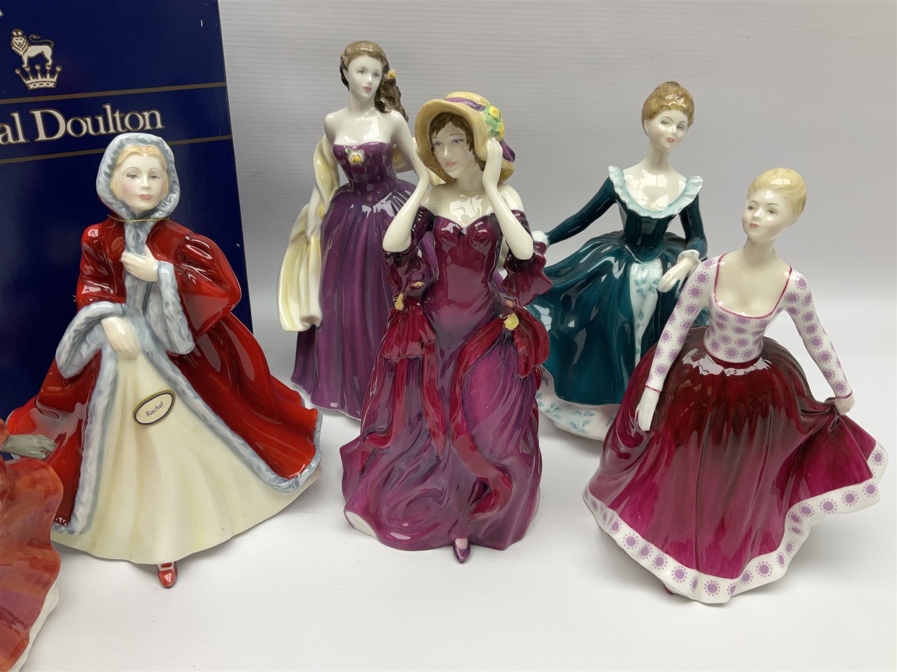 Eight Royal Doulton figures, comprising Rachel HN2936, The Skater HN3439, Janine HN2461, Innocence HN2842, Special Celebration HN4234, Autumn HN4272, Fiona HN2694 and Winsome HN2220, together with three smaller Royal Doulton figures My First Figurine HN3424, Buttercup HN3268 and Autumn Breezes HN2176
