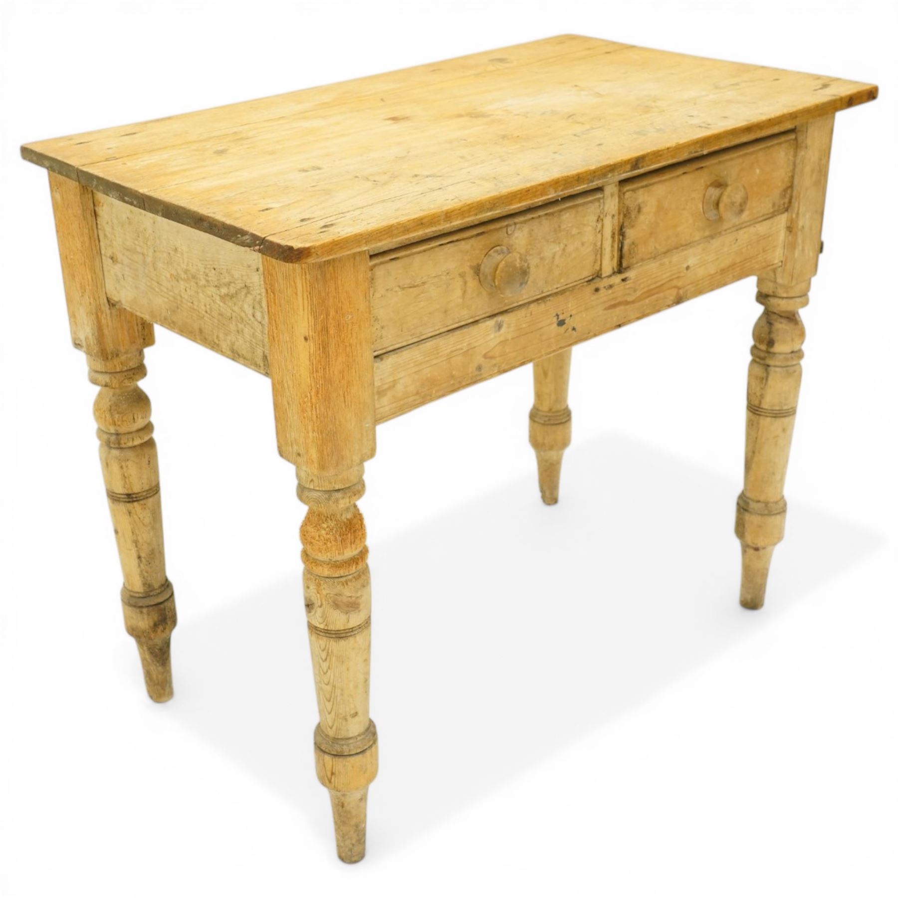 Victorian stripped pine table fitted with two drawers, supported on turned supports