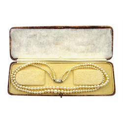 Double strand pearl necklace, graduating pearls between 3mm and 7.5mm, on 18ct white gold old cut diamond and opal milgrain set clasp, boxed