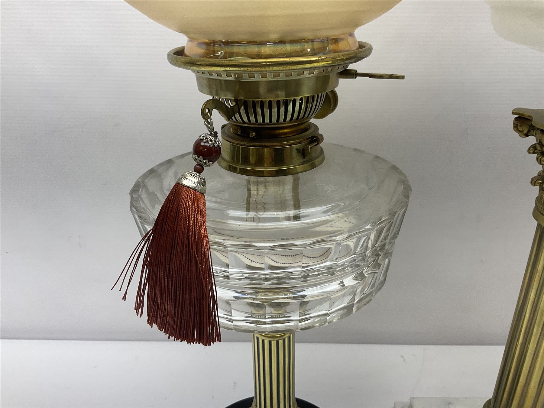 Brass Corinthian column oil lamp, upon stepped marble base, together three other brass table lamps, tallest H68cm