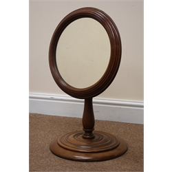 Victorian mahogany adjustable toilet mirror, circular plate in reeded surround, baluster turned column with brass adjust on ring turned stepped circular base, H79cm, W36cm, max  