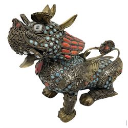 Early 20th century Chinese filigree brass model of a Foo Dog, with turquoise and coral roundels and lozenges, H11.5cm