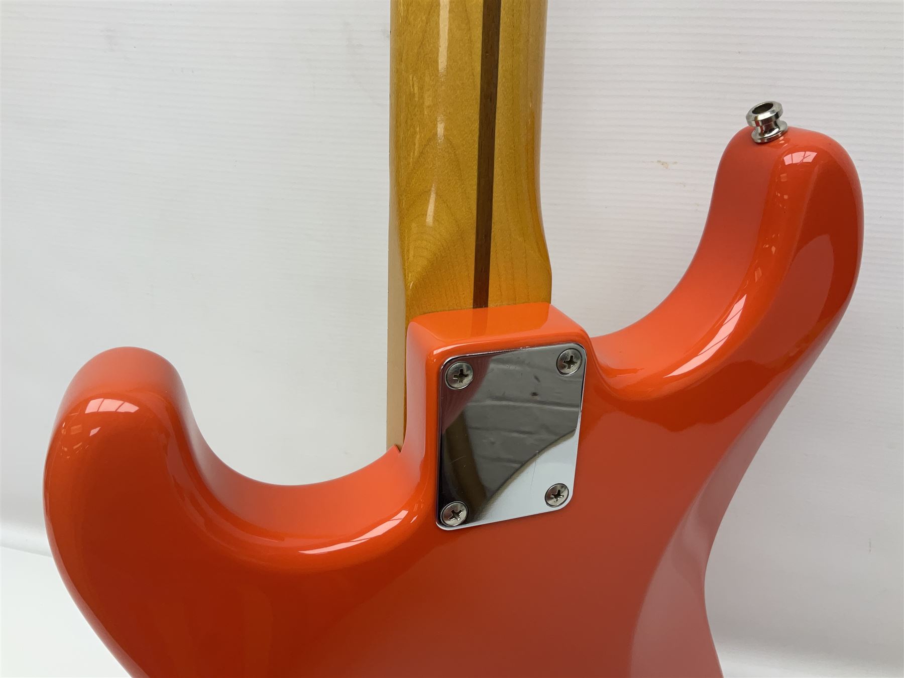 Japanese Squier Fender 'Hank Marvin' Stratocaster electric guitar, c1992, in Fiesta red with tremolo arm and facsimile signature decal; serial no.L037281, L98cm; in hard carrying case.