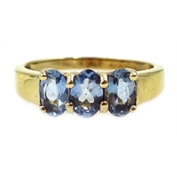  9ct gold three stone blue topaz ring, hallmarked  