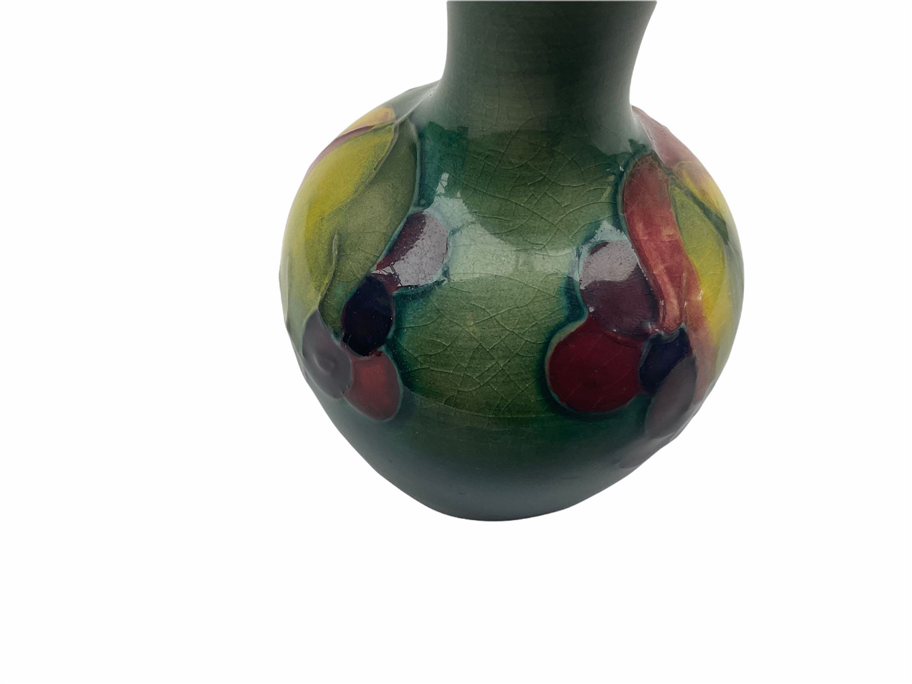 Moorcroft vase, decorated in the Leaf and Berries pattern upon a tonal green ground, together with a further Moorcroft vase, of squat baluster form, decorated in the Iris pattern upon a tonal green ground, each with impressed marks beneath, each H9cm. 