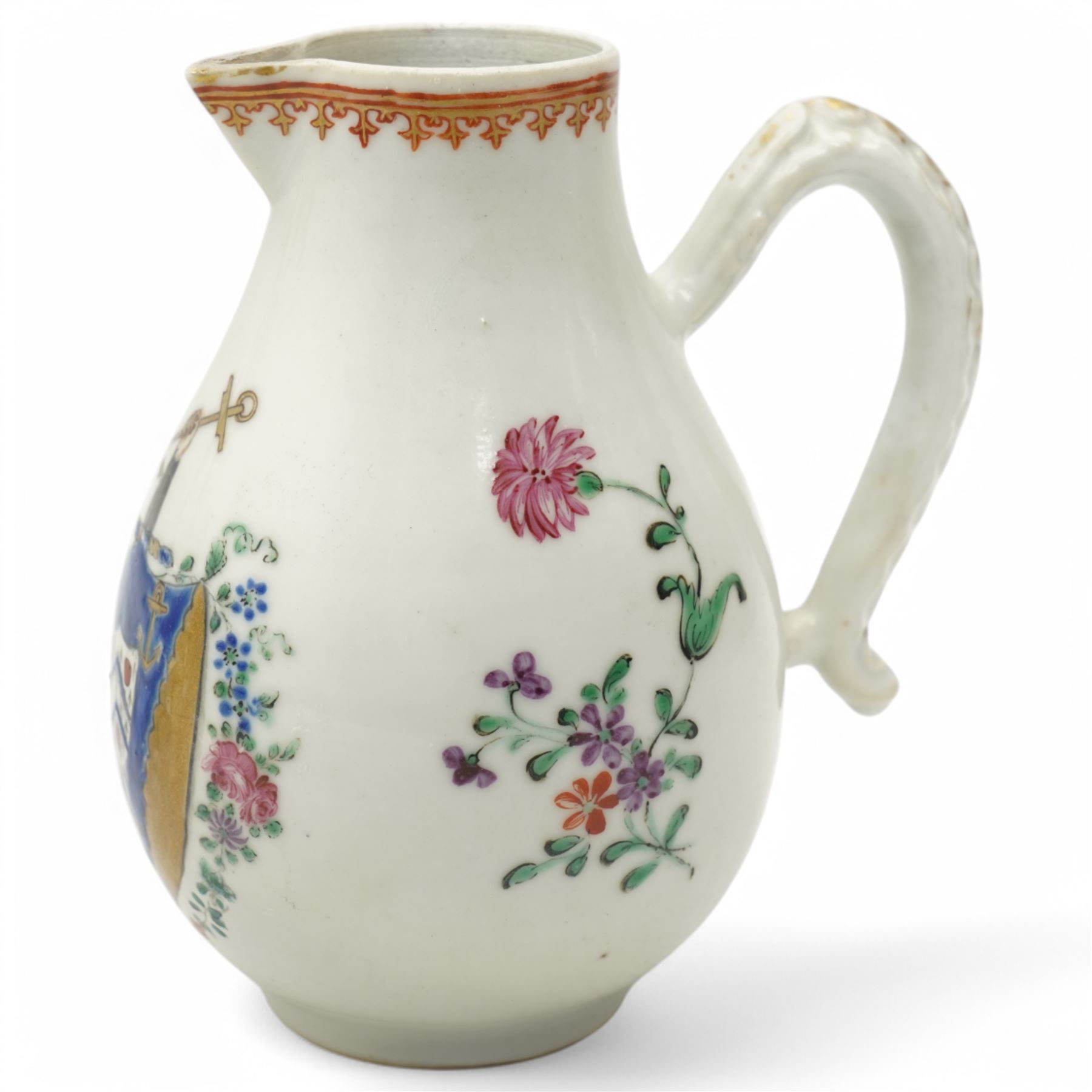 Chinese export Armorial part service decorated with sprays of flowers and a crest of an arm holding an anchor comprising bowl D23cm, pair of octagonal plates 16cm and sparrow beak jug H12cm (4)