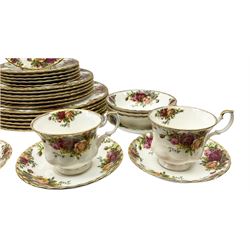 Royal Albert Old Country Roses pattern tea and dinner wares, comprising six dinner plates, six dessert plates, six bowls, six saucers, and four teacups. 