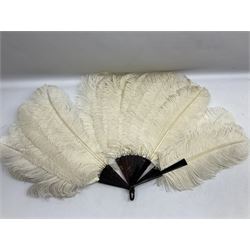 Large 20th century ostrich feather fan, the eighteen extravagant feathers mounted on dark tortoiseshell effect monture, with loop carrying handle, L58cm