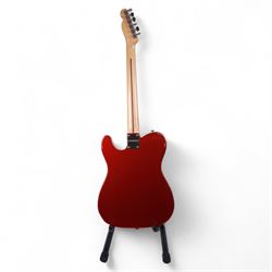 Fender Telecaster electric guitar, serial no. T021384 made in Japan c.1994, with Candy Apple Red body, white scratch plate and maple neck, guitar L98cm