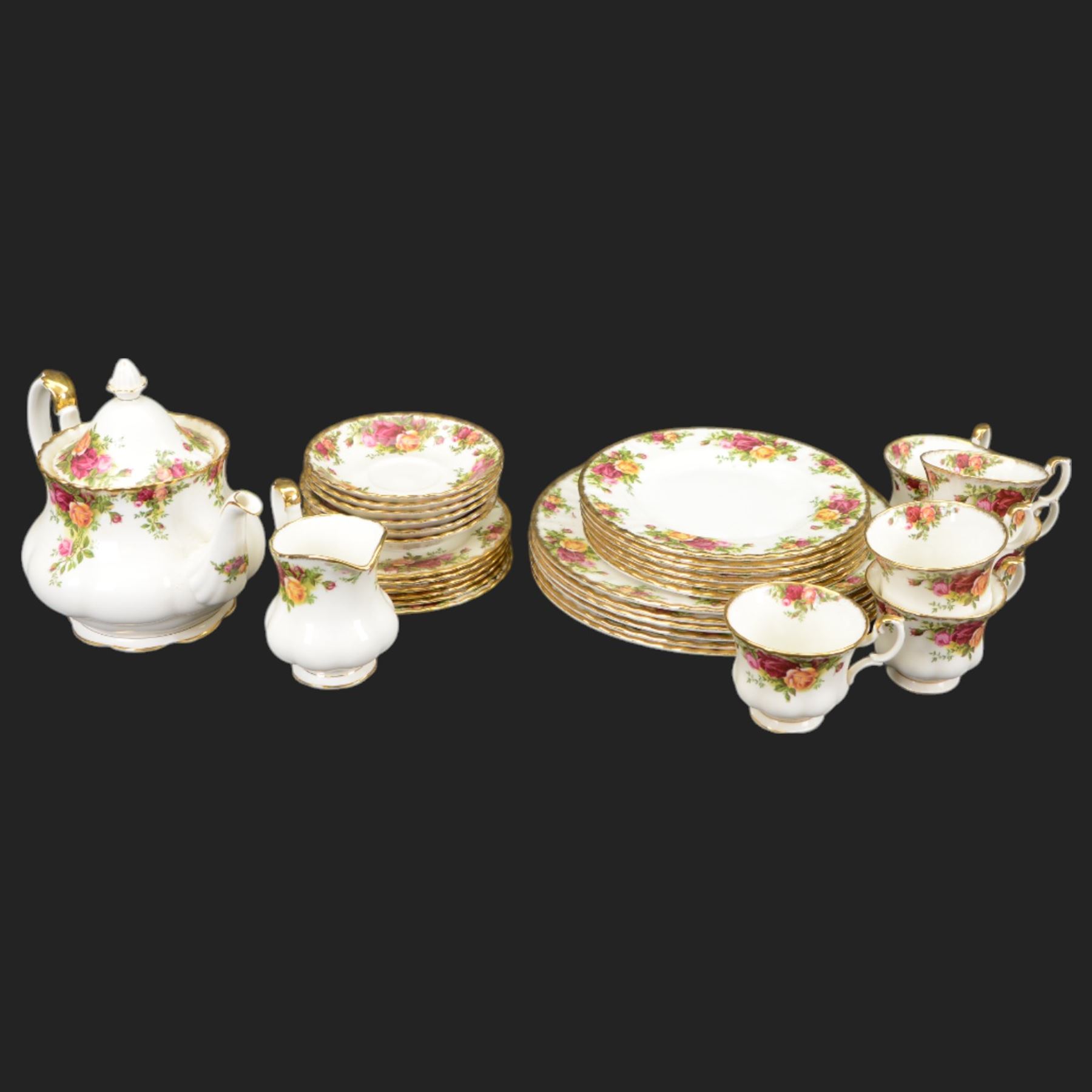 Royal Albert Country Roses tea and dinner service for six place settings, comprising teapot, milk jug, cups and saucers, dessert plates, side plates and dinner plates, all with printed mark beneath 