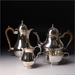 Four piece silver tea and coffee service of baluster form, the tea and coffee pots with do...