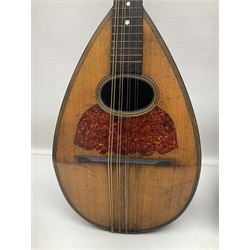 Late 19th century Italian lute back mandolin with segmented bowl back, bears label Gennaro Maglioni Napoli L61cm; in ebonised wooden case; together with another similar damaged Italian lute back mandolin for restoration or spares (2)