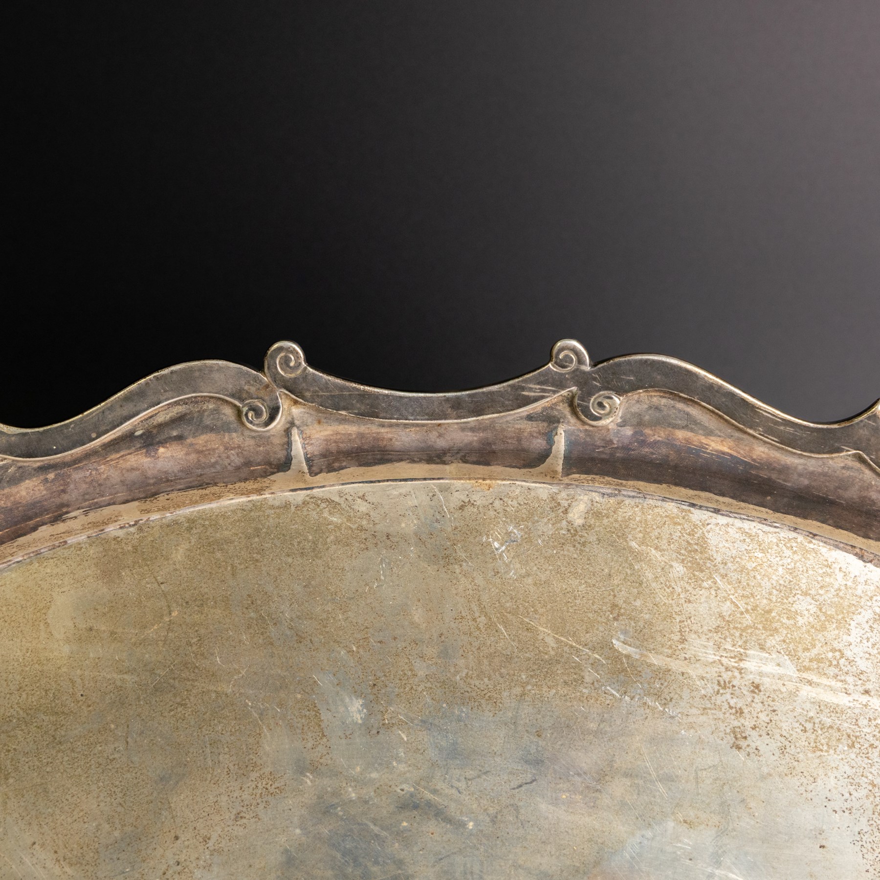 Edwardian silver twin handled tray, of navette form with C scroll decoration to the outer rim, hallmarked Goldsmiths & Silversmiths Ltd, London 1907, handle W61cm