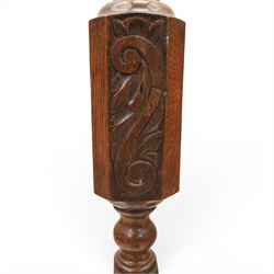 Late Victorian set of two oak standard lamps, turned and carved column supports, one with foliate carved panelled stem, on stepped square bases with carved scroll feet, the other on circular moulded spreading base