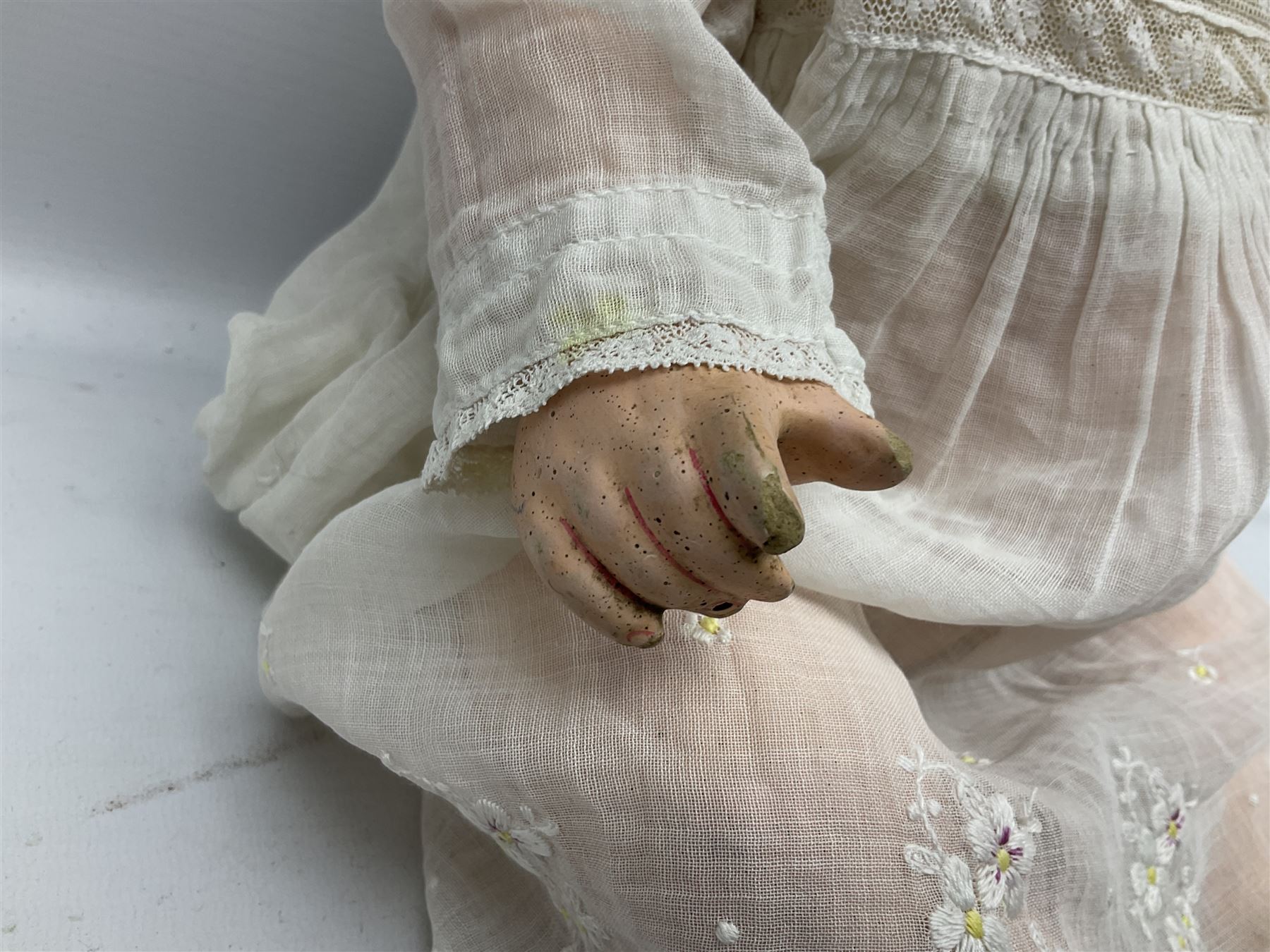 Heubach Koppelsdorf Germany bisque head doll with applied hair, sleeping eyes, open mouth with teeth and composition body with jointed limbs; marked 'Heubach Koppelsdorf 342.6/0 Germany' H34cm; Armand Marseille bisque head baby doll with moulded hair, sleeping eyes, open mouth and composition body with jointed limbs; marked 'A.M. Germany 351./8.K.; and BND London all composition doll (3)