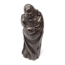  Chinese rosewood carving of an immortal, his robe incised with symbols and script, H39cm  