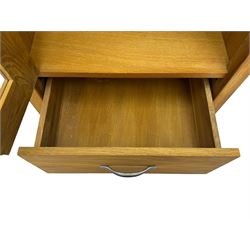 Laura Ashley - contemporary Milton oak display cabinet, featuring single door with two glass panels and pewter effect handle, enclosing one fixed oak shelf and two adjustable glass shelves, access hole at the bottom shelf, over single drawer with matching handle, on square legs