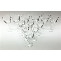 Two sets of wine glasses, probably Stuart Ariel, each with air twist stems, comprising six glasses in each set, each set approximately H18cm