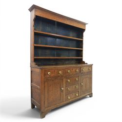 18th century Georgian oak dresser and rack, three back-boarded plate shelves, above six dr...