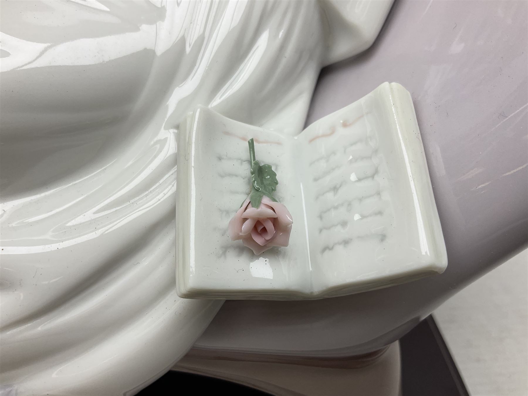 Lladro figure, Garden of Dreams, modelled as a woman reclining in front of trellis of flowers on a mahogany base, limited edition 3129/4000, sculpted by  José Puche, with original box, no 7634, year issued 1994, year retired 1996, H32cm