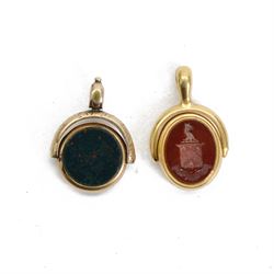 Two 19th century gold swivel fobs, the first 18ct example set with bloodstone and carnelian engraved with monogram and armorial, bearing hallmarks, the second 9ct example with bloodstone and chalcedony, set within simple mounts, each approximately H3cm 

Provenance: By family descent from the Chichesters of Arlington Court, Devon; from the collection of Andrew Chichester Everitt.
