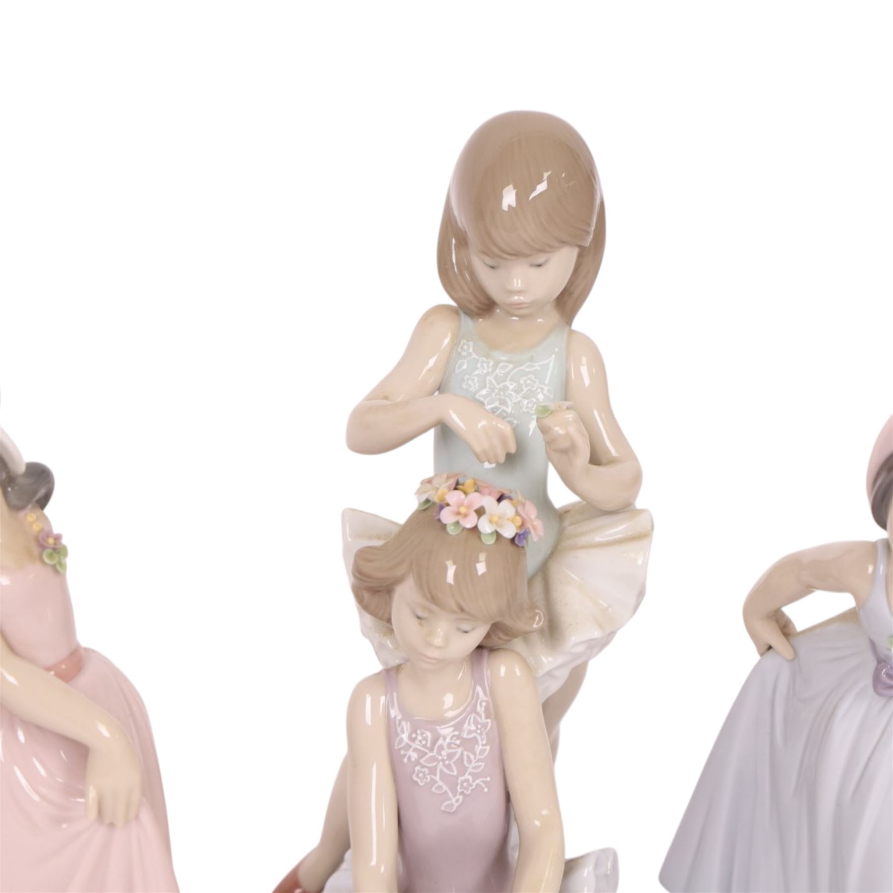 Four Lladro figurers, comprising First Ballet 5714, Iris 6276, Rose 6275 and Daisy 6274, all boxed 