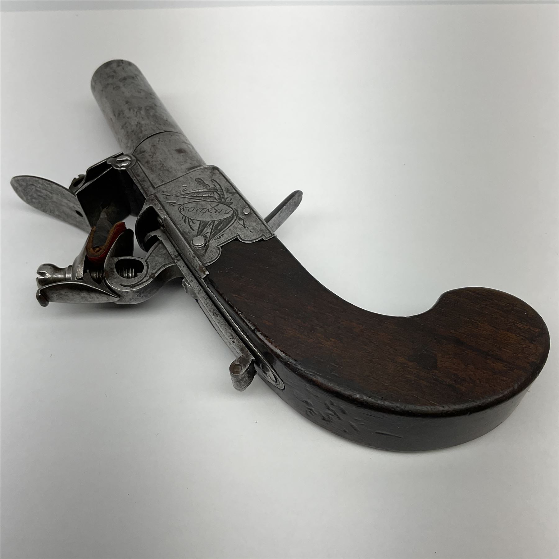 Late 18th century flintlock pocket pistol signed H. Nock London with 4cm turn-off barrel and drop down trigger, engraved lock plates, thumb safety and walnut bag stock L16cm overall