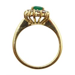 18ct gold oval emerald and diamond cluster ring, stamped