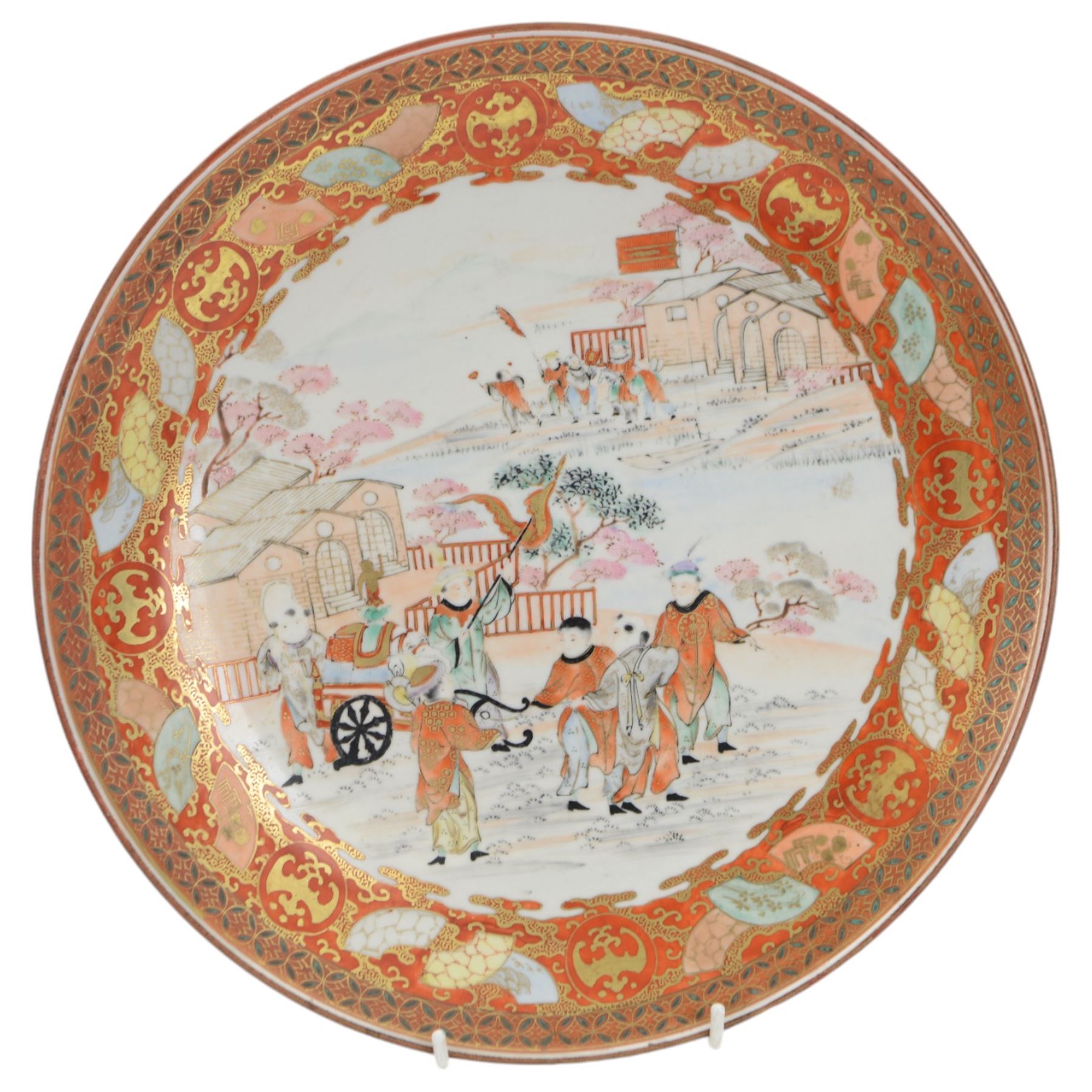 19th century Japanese Kutani charger, painted with a procession of figures and elephant within a hillside landscape detailed with dwellings, with character mark beneath, D30.5cm