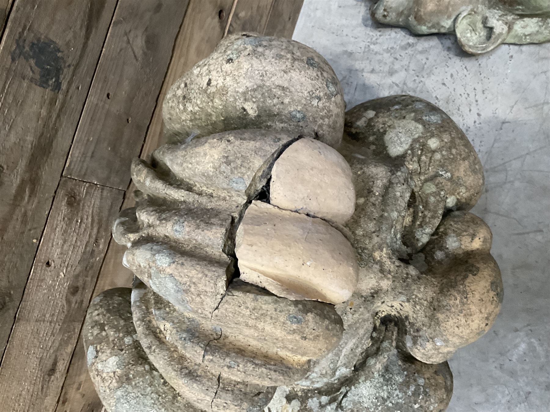 Four grotesque garden wall masks