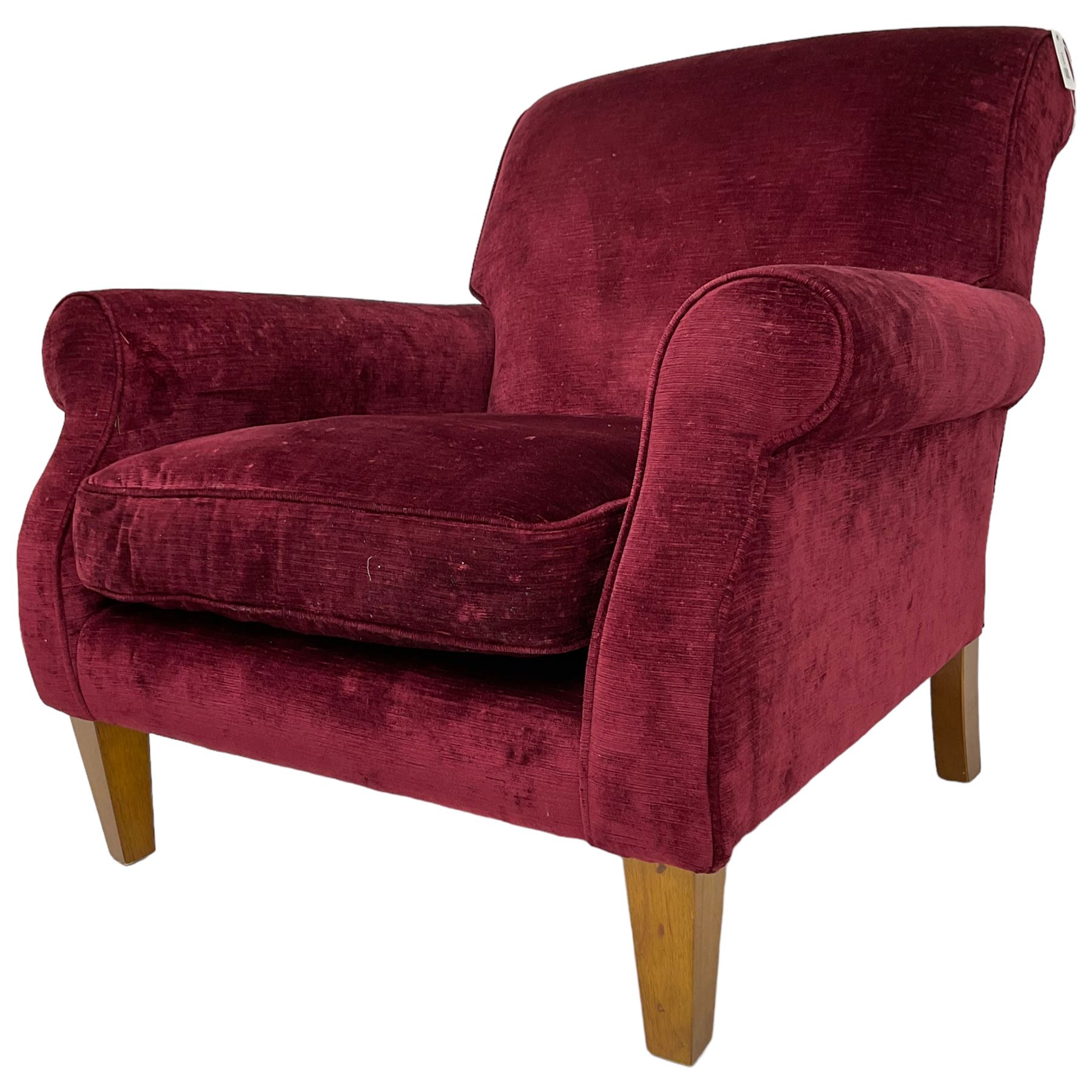 Duresta - traditional shape armchair upholstered in burgundy red velvet, on square tapering front supports (W88cm, H85cm, D103cm); together with a matching rectangular footstool with hinged seat, on turned feet with brass castors (73cm x 54cm, H38cm)