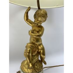 Pair of 19th century style ormolu table lamps, the stems formed as putto seated upon naturalistically modelled stumps, each upon fluted marble column base detailed with ormolu floral swag, and hexagonal plinth with ormolu band, with white fabric shades, H46cm