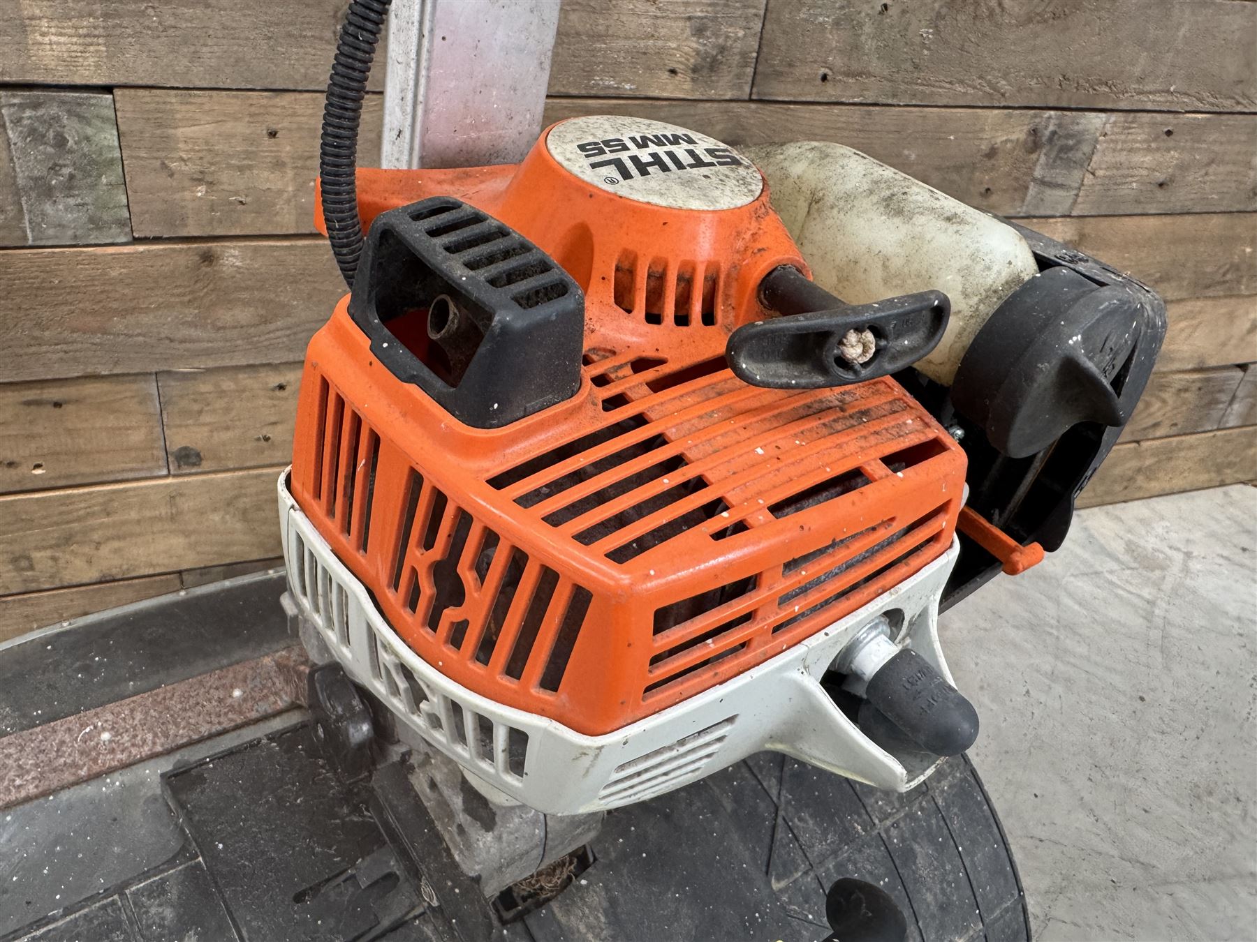 Stihl MM55 petrol multi system with scarifier attachment