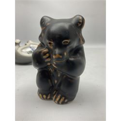 Four Royal Copenhagen animal figures, comprising brown bear cub modelled by Knud Kyhn no 21435, seated Dachshund no 3140, bear cub 1124 and squirrel no 982, all with painted and printed marks beneath, tallest H8.5cm