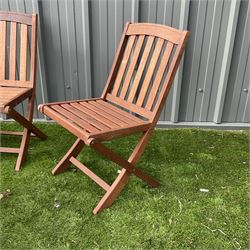 Cotswold Collection - three teak folding garden chairs and foldable table  - THIS LOT IS TO BE COLLECTED BY APPOINTMENT FROM DUGGLEBY STORAGE, GREAT HILL, EASTFIELD, SCARBOROUGH, YO11 3TX