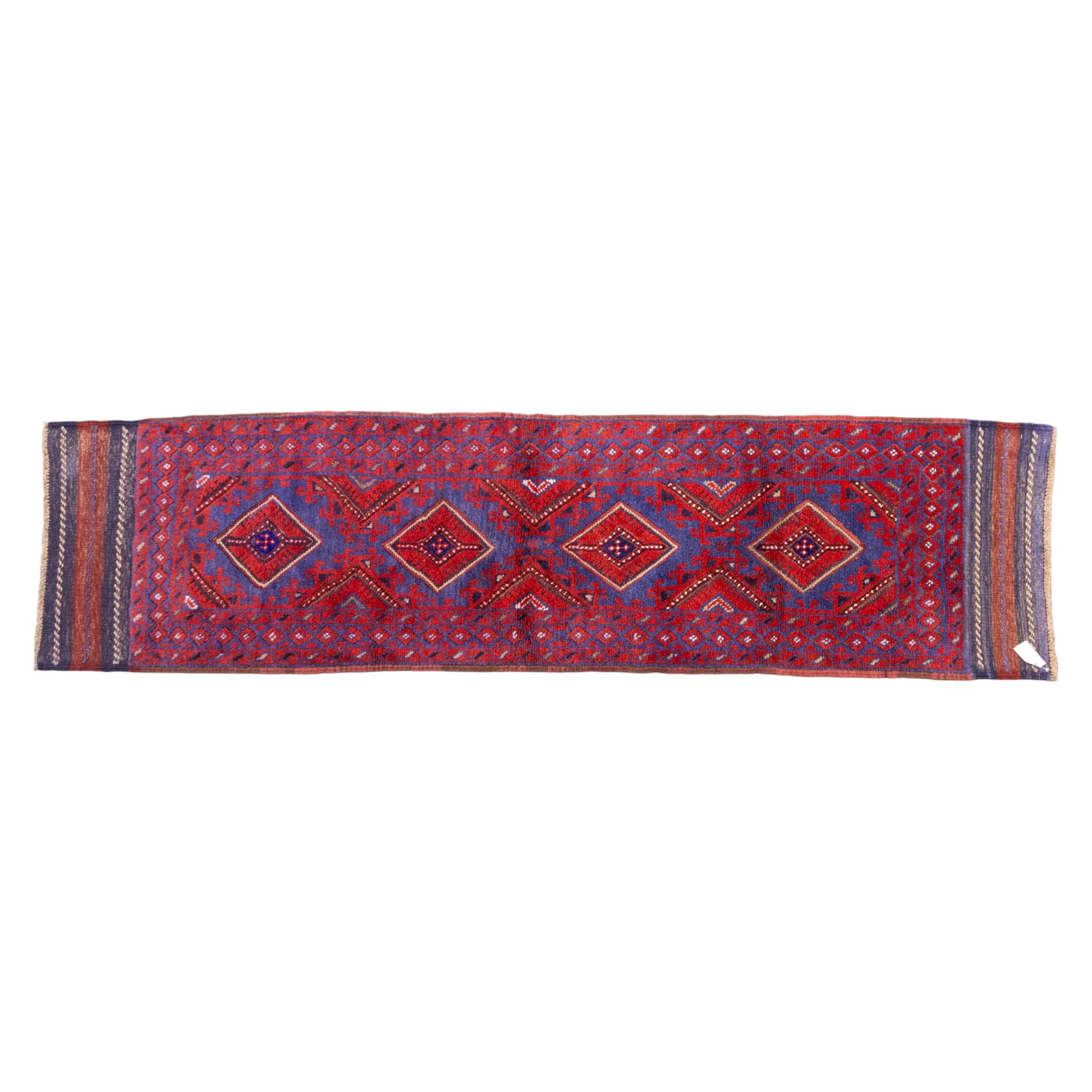 Afghan Meshwani runner, hand-knotted wool pile, indigo ground decorated with a vertical series of angular diamond medallions in tones of madder red, dark blue, framed by geometric borders with flatwoven kilim ends with fringe 