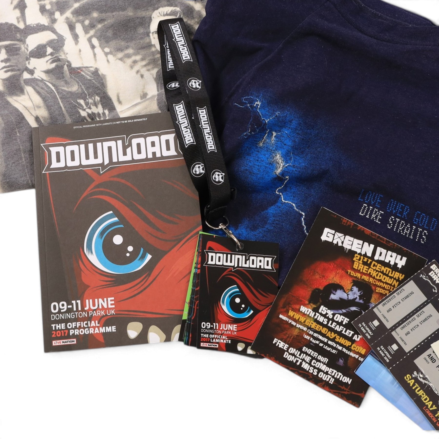 Collection of 1980s and later music tour merchandise and records, including Dire Straits Love Over Gold t-shirt, U2 Zooropa t-shirt, Bruce Springsteen Born In The USA tour programme, Bruce Springsteen Cover Me Stand Up picture disc and sleeve, Bruce Springsteen Born In The USA picture disc, Bruce Springsteen Western Stars limited edition coloured vinyl, Depeche Mode Singles Tour programme 1986-88, Journey 1986 programme and ticket stub, Journey Eclipse Collectors Edition Set and 2017 Download Festival passes