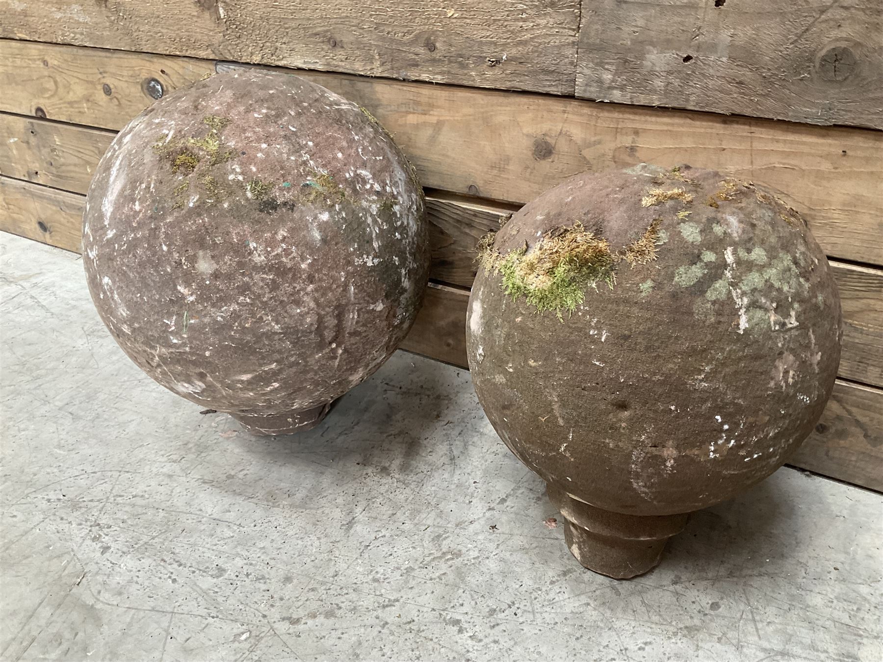 Two spherical stone gate post finials