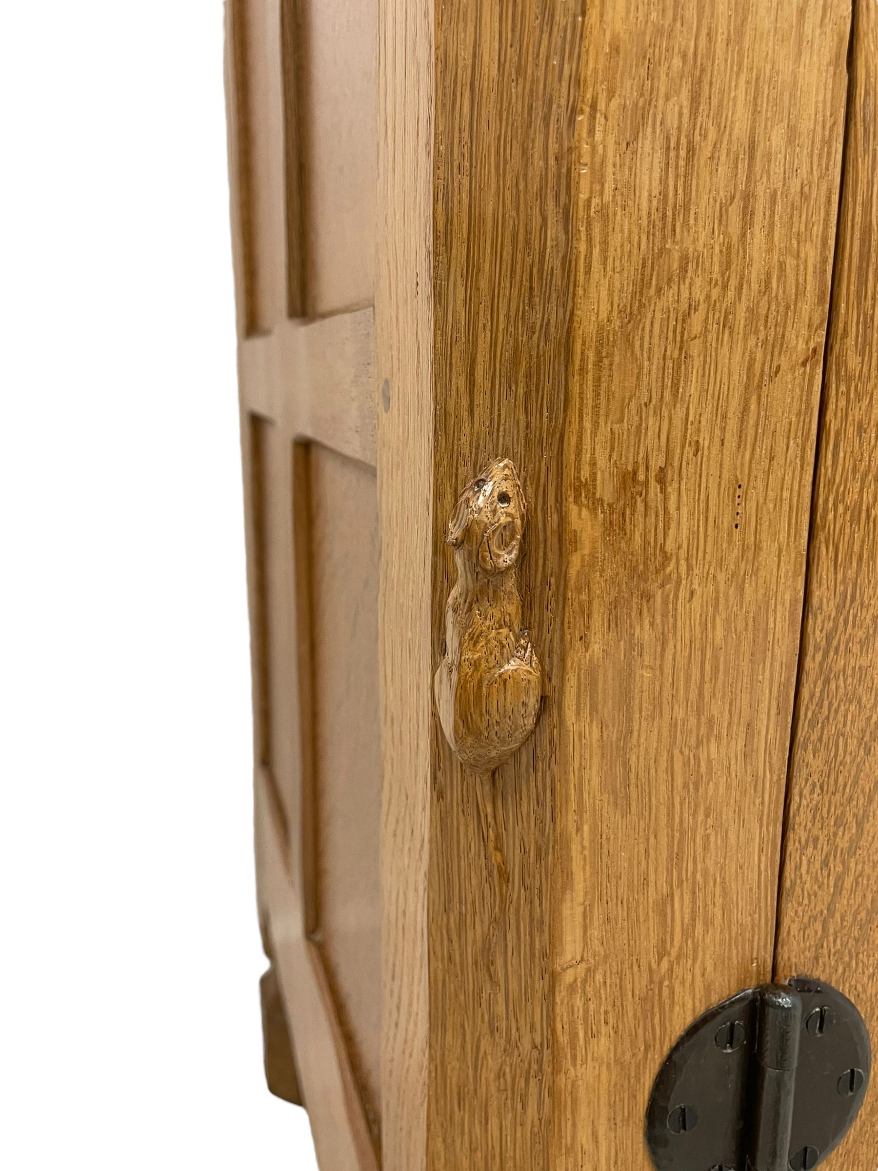 Mouseman - oak dresser, rectangular adzed top with raised back over three central drawers and two flanking cupboards, enclosed by panelled doors with wrought metal fixtures, the canted upright carved with mouse signature, on octagonal feet, by the workshop of Robert Thompson, Kilburn