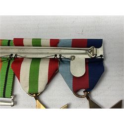 WW2 group of four medals comprising 1939-1945 War Medal, Defence Medal, Italy Star and 1939-1945 Star; with Royal Army Service Corps cap badge and RASC chrome and enamel sweetheart brooch