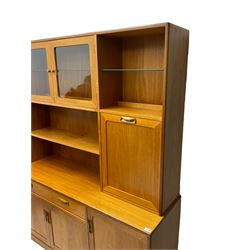 G-Plan - teak wall unit, raised display cabinet with shelves and fall front compartment, fitted with drawer, double cupboard and single cupboard below