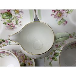 Royal Doulton Apple Blossom pattern tea service for twelve, comprising twelve saucers, twelve tea plates, twelve teacups, milk jug, sucrier and two cake plates