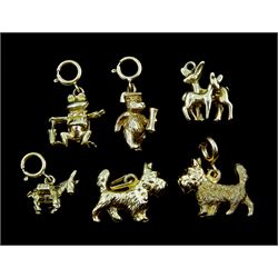 Six 9ct gold charms including two West Highland terriers, frog, donkey, deer and graduation bear, all stamped or hallmarked 