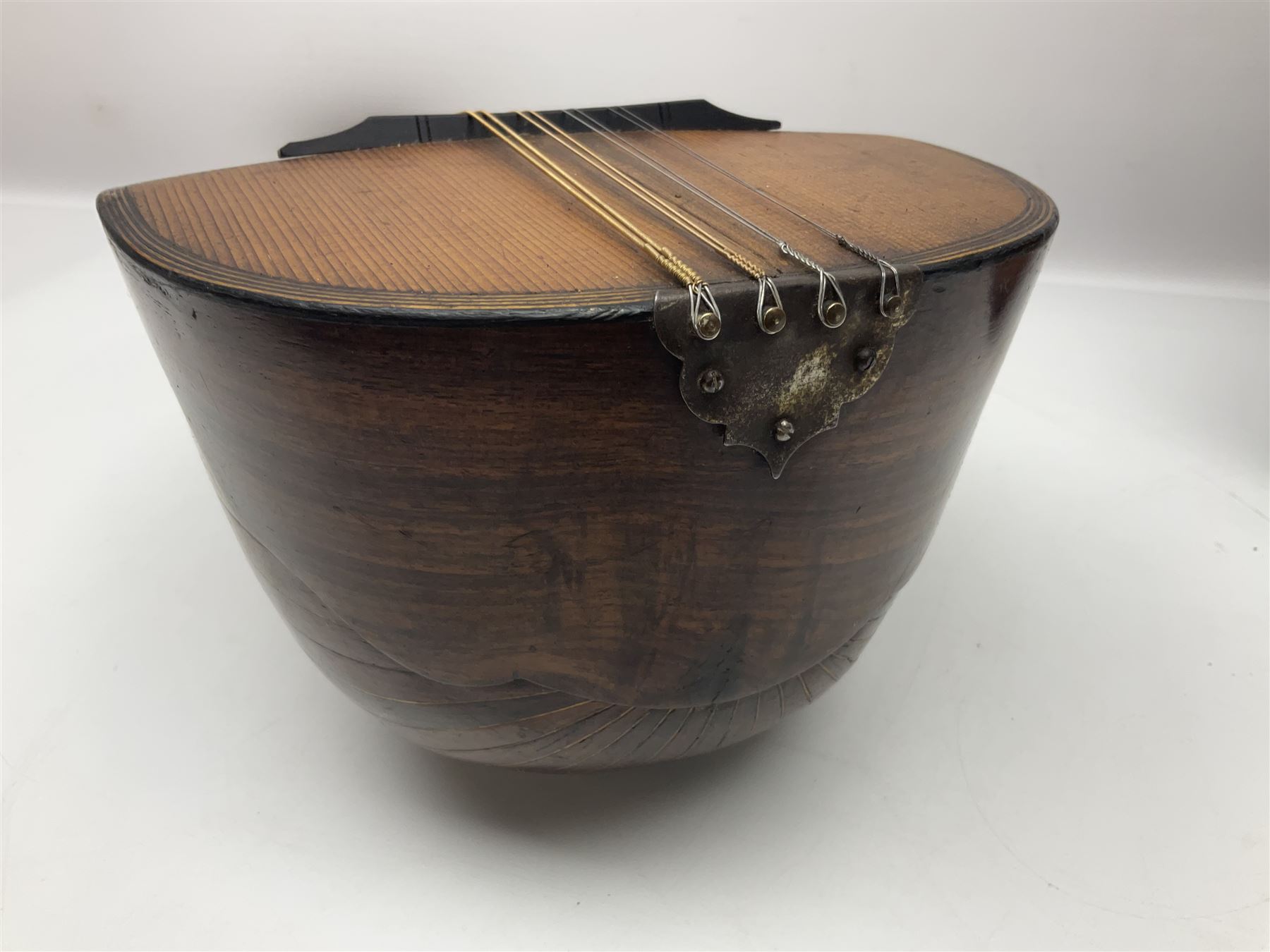 Late 19th century Italian lute back mandolin with segmented bowl back, bears label Gennaro Maglioni Napoli L61cm; in ebonised wooden case; together with another similar damaged Italian lute back mandolin for restoration or spares (2)