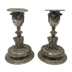 Pair of Victorian Elkington Mason & Co silver plated candlesticks, decorated in relief with ram masks and figures, H14cm
